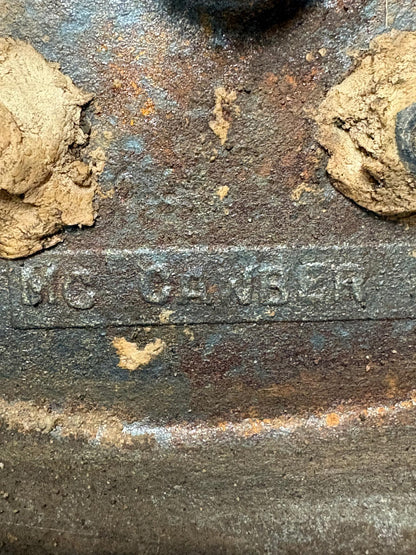 Early 20th‑century cast‑iron doorstop of Bob Cratchit & Tiny Tim from Dickens’ A Christmas Carol.